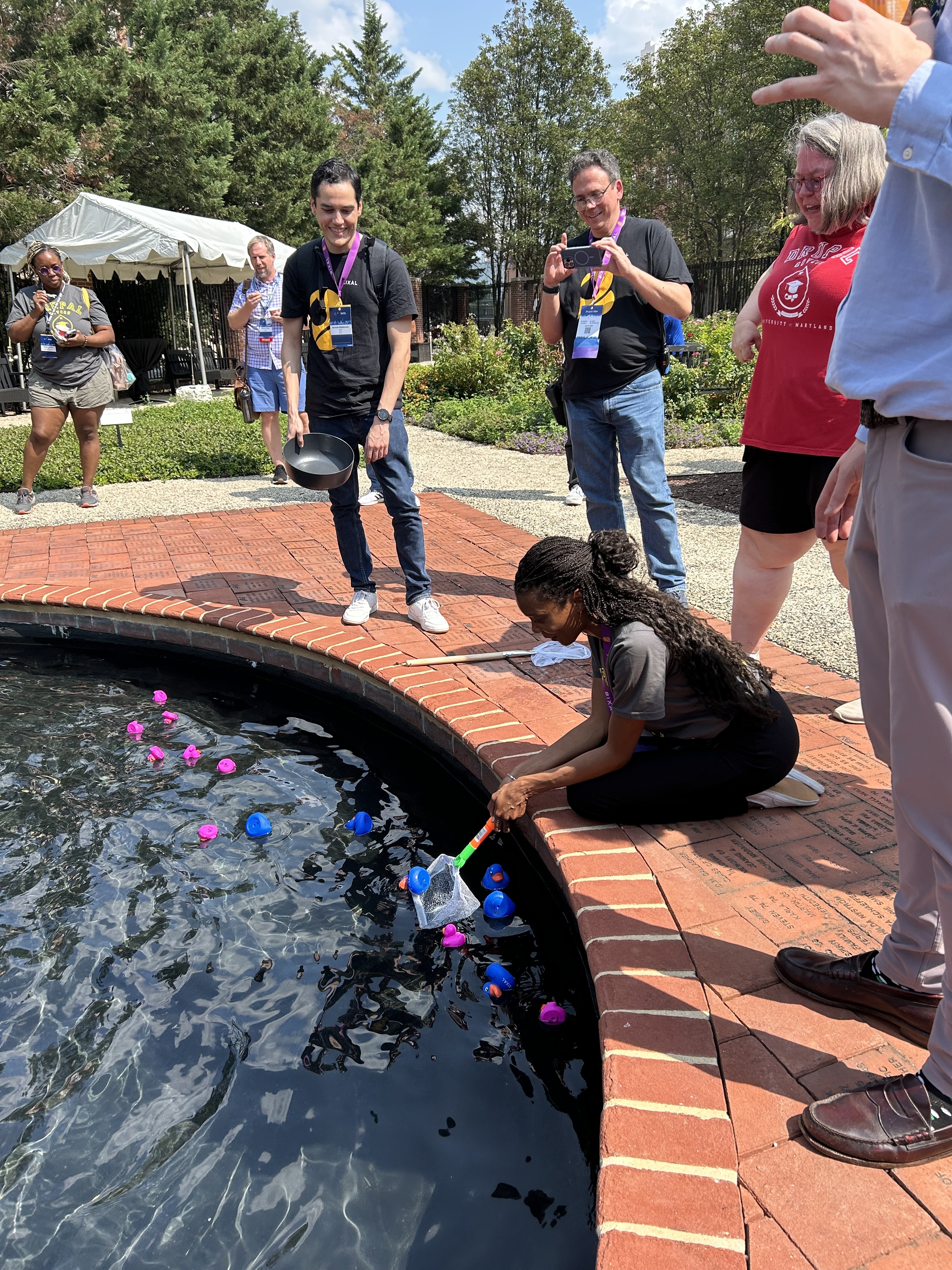 Sponsor hosting a social event, a duck race on a campus pond.