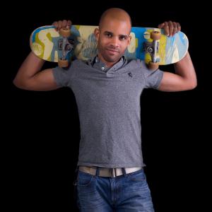 Keenan holding a skateboard